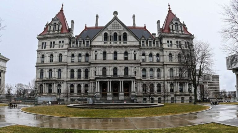 New York lawmakers pass third budget extension as stalemate continues