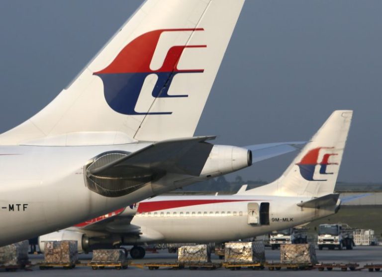 Man arrested after Malaysian Airlines plane from Sydney to Kuala Lumpur forced to turn around mid-flight