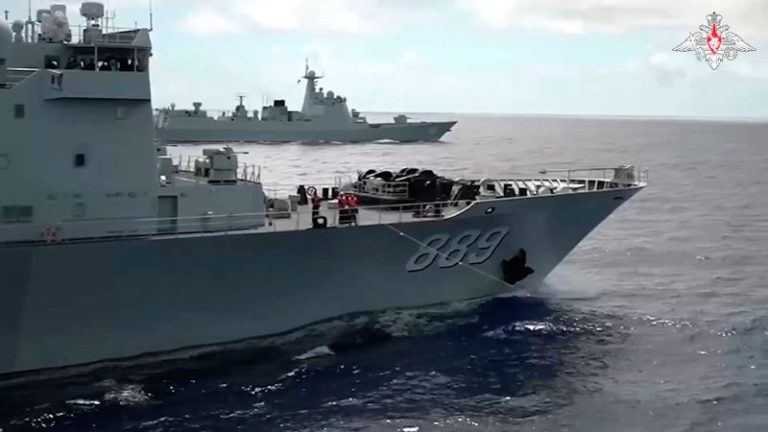 Russian and Chinese warships sail close to Japanese islands on eve of Biden’s trilateral summit