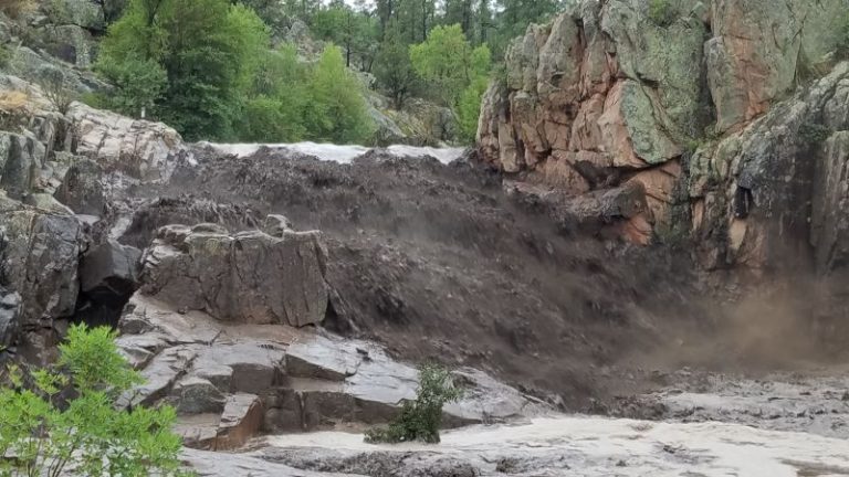 ‘Catastrophic flooding’ damages hundreds of homes as a city engulfed in water is now at risk of dam failure