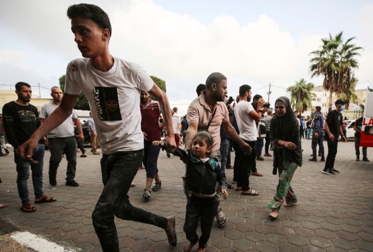 Names written on children’s bodies speak to the fears of Gazan parents amid the Israel-Hamas war