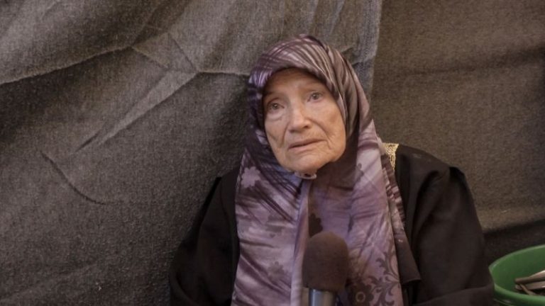 She fled the Israeli army as a young woman. Now in her 90s, she is running again