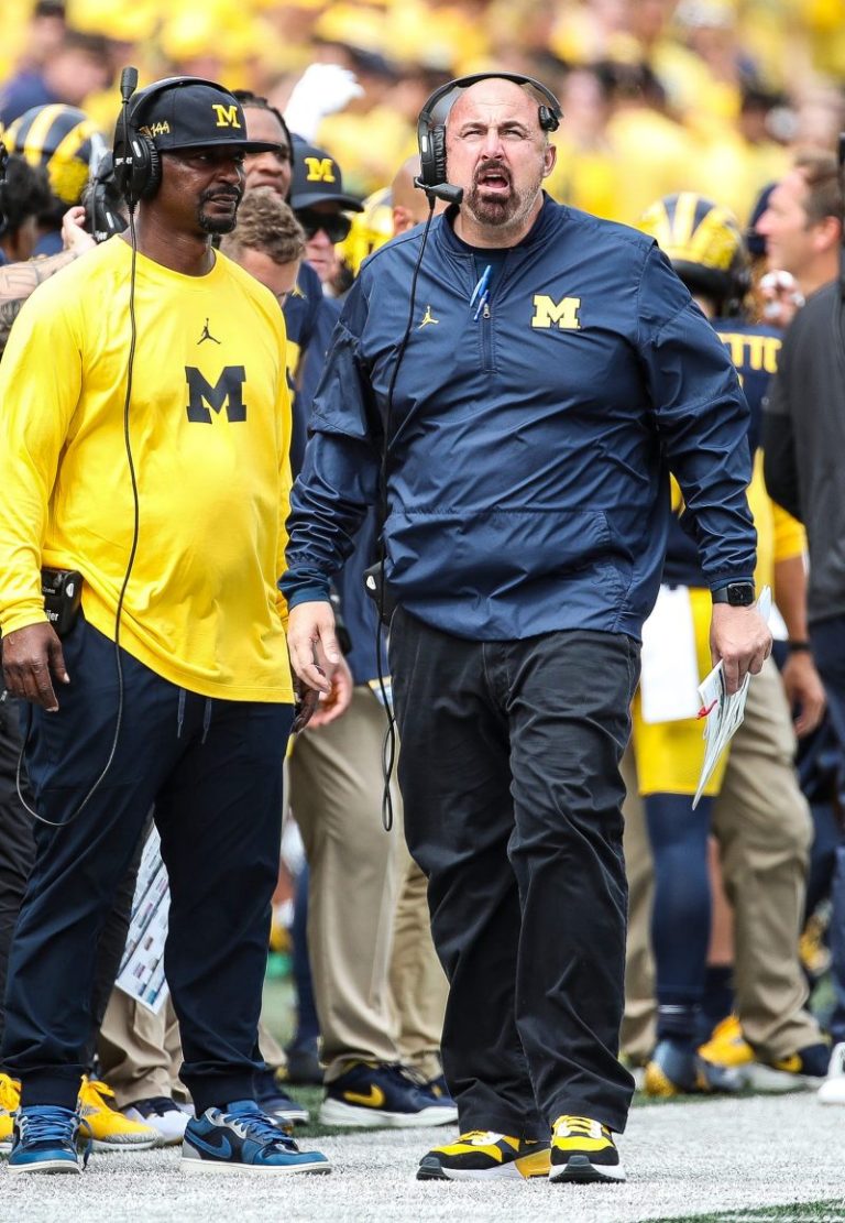 Michigan fires assistant one day after Harbaugh accepts suspension