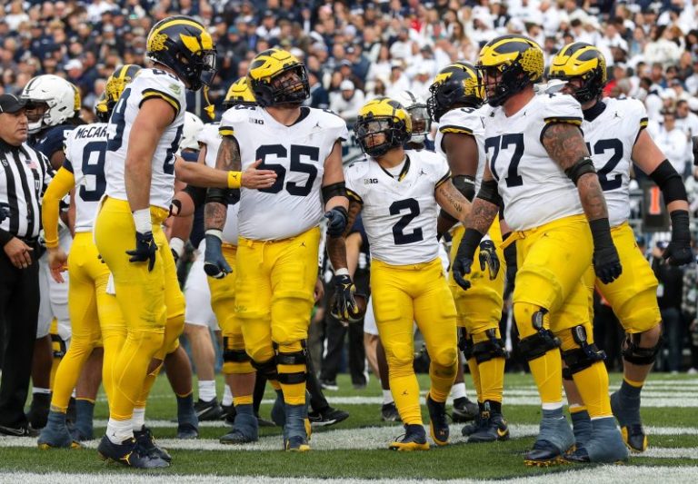 No. 2 Michigan stays perfect with Harbaugh-less win at Penn State