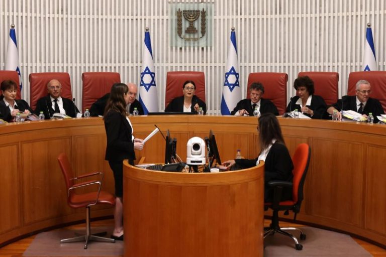 Israel’s top court strikes down key part of judicial overhaul, in ruling that could reignite divisions as war rages