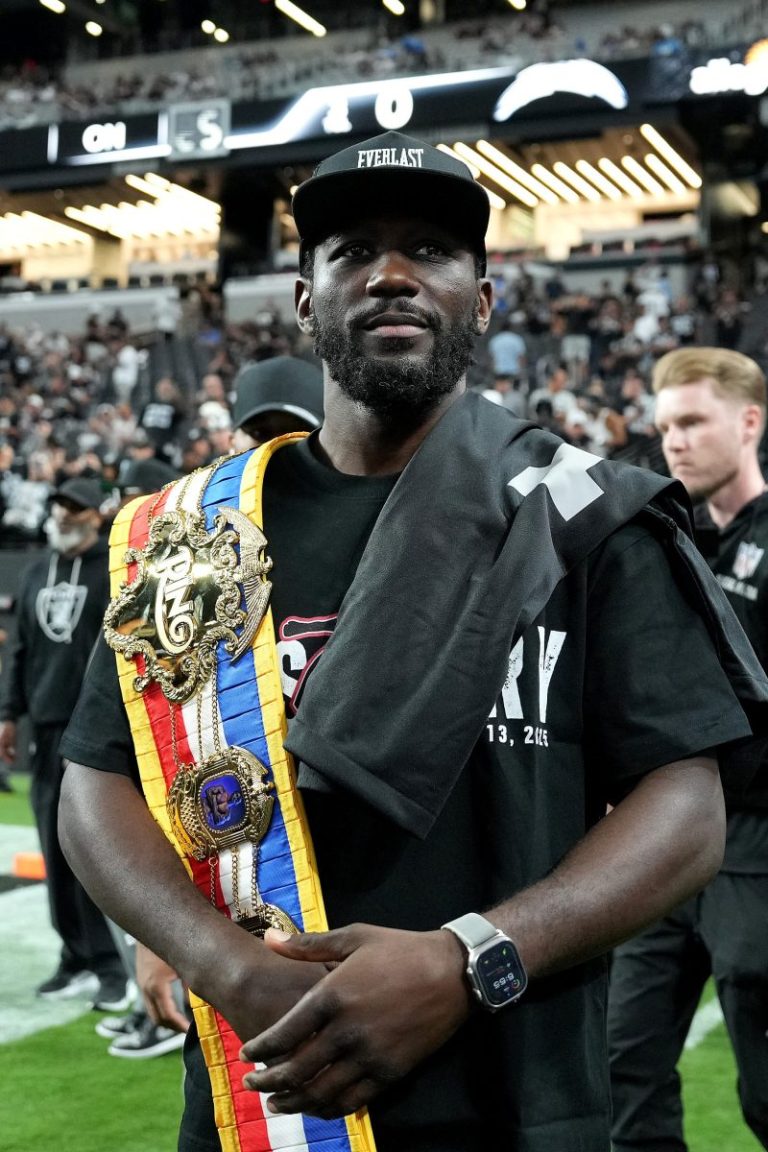 Boxing champ held at gunpoint by police during traffic stop